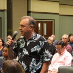 A Tampa resident asks the panel a question at the public event at Robert W. Saunders Public Library 